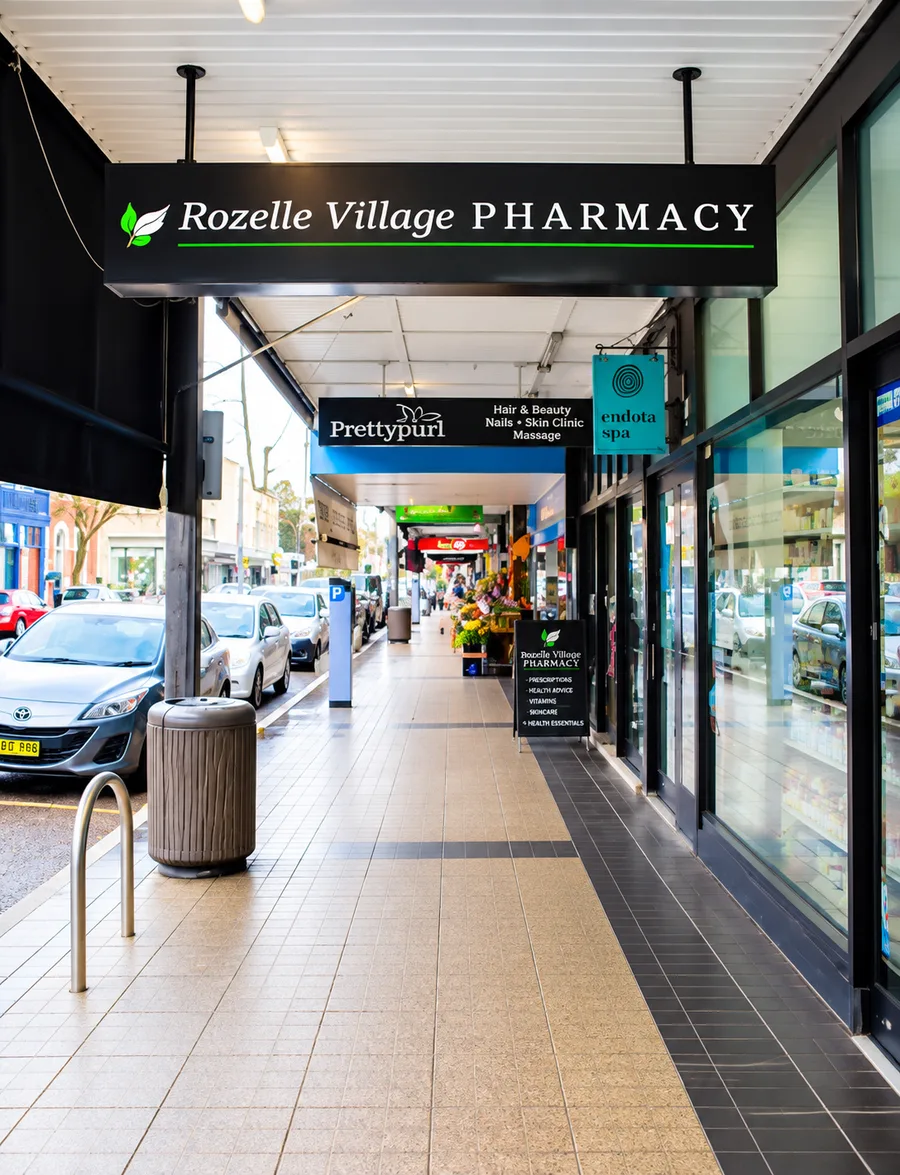 Rozelle Village Pharmacy entrance beneath the Darling Street arcade sign